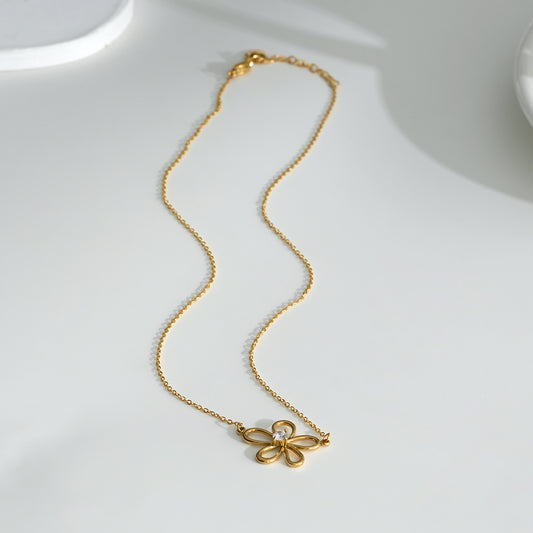 Collier doré fin avec pendentif fleurs et zircon