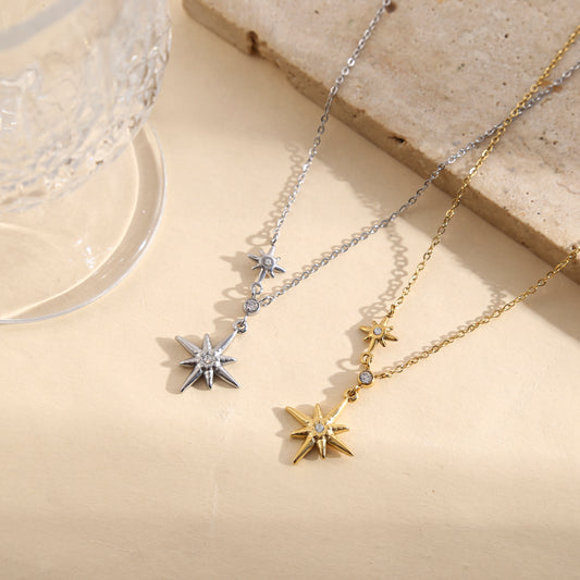 Collier doré chaîne fine pendentif étoile 8 branches strass central