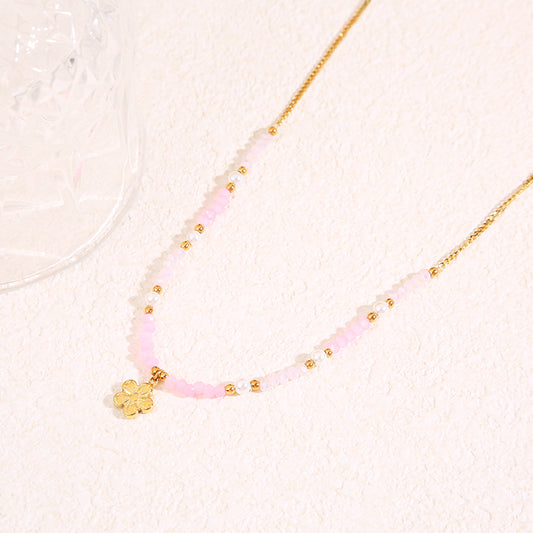Collier doré cristaux pendentif fleur
