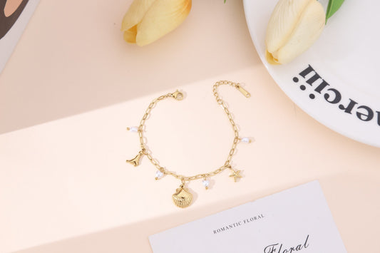 Bracelet chaîne cœurs perlés blancs et charms marins