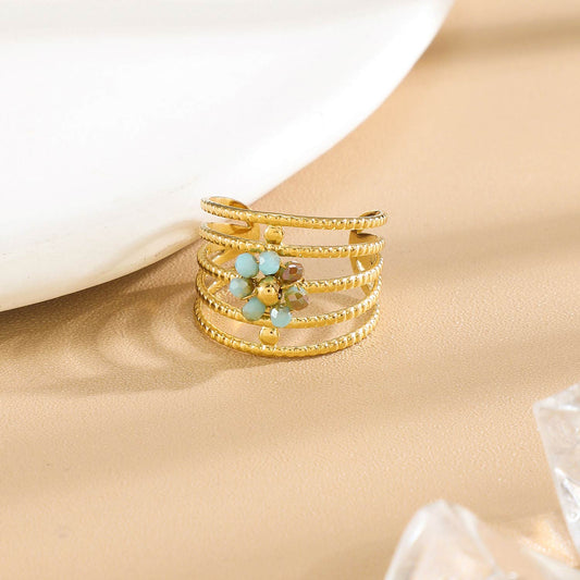 Bague Dorée Multi Anneaux Torsadés Floral Avec Cristaux Bleues
