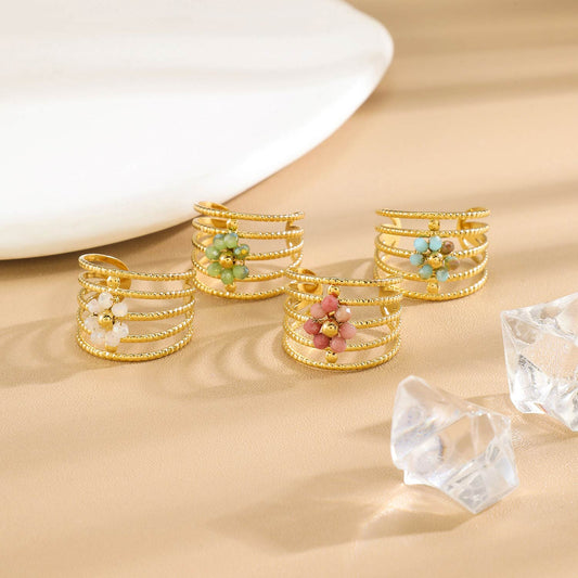 Bague Dorée Multi Anneaux Torsadés Floral Avec Cristaux Bleues