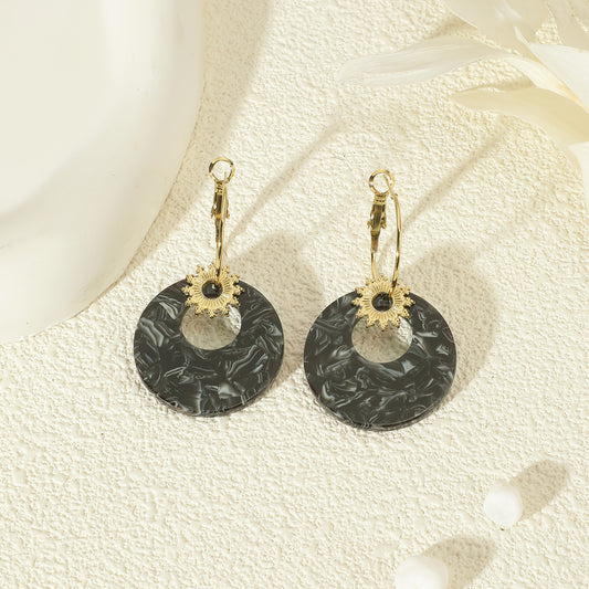 Boucles d'oreilles Dorées Soleil Pendantes Acrylique Noire
