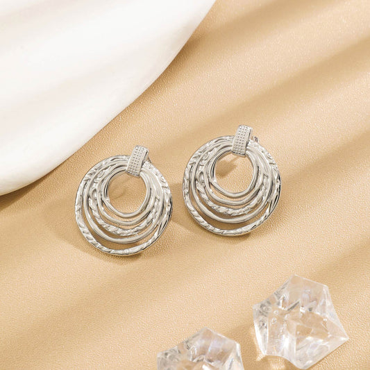 Boucles d'Oreilles Argentées Anneaux Multiples Texturés