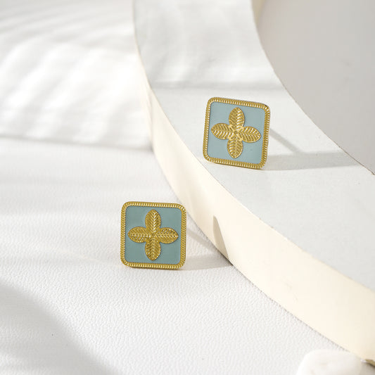 Boucles d'oreilles carrés bleu avec trèfles