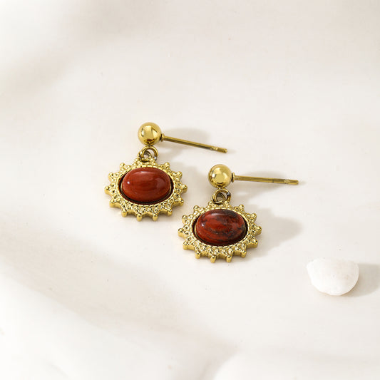 Boucles d'Oreilles Dorées Pendantes Soleil Pierre Rouge