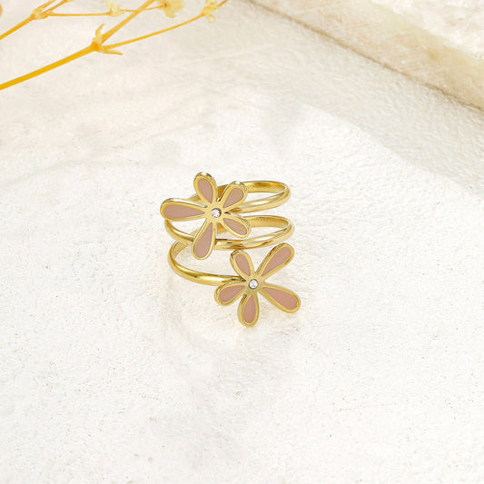 Bague dorée spirale double fleurs roses