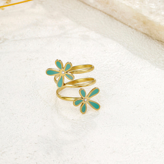 Bague dorée spirale double fleurs bleues