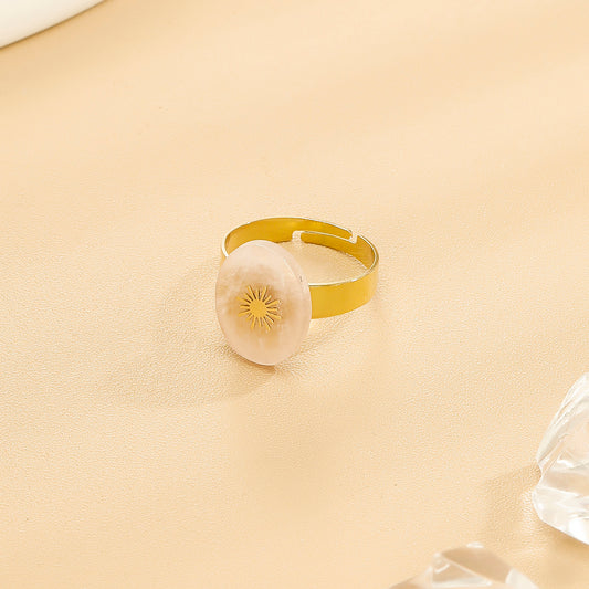 Bague Dorée Ajustable Avec Pierre Ovale Rhodochrosite Et Motif Solaire