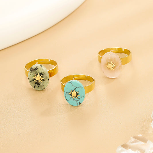 Bague Dorée Ajustable Avec Pierre Ovale Rhodochrosite Et Motif Solaire