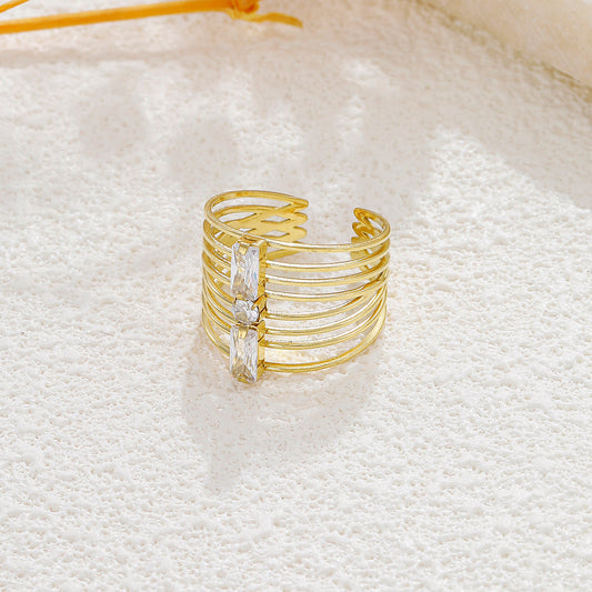 Bague dorée 8 branches strass avant rectangle et rond