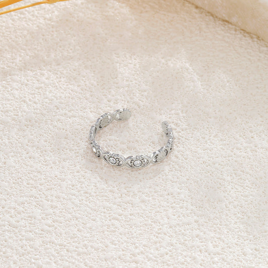 Bague argentée ajustable motif infini ajouré ornée de soleil et de strass