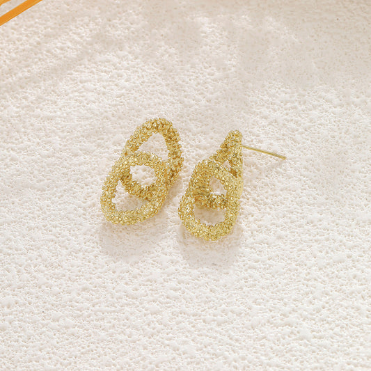 Boucles d'oreilles double cercles dorée texturée scintillante