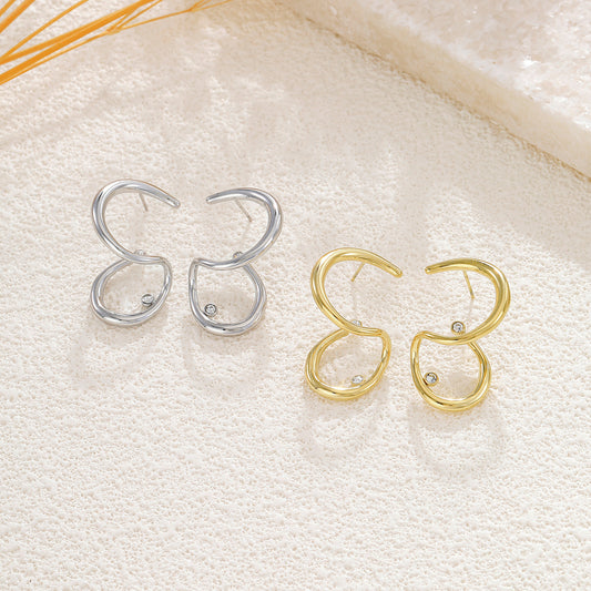 Boucles d’oreilles dorées anneaux ouverts en forme de goutte asymétrique strass central