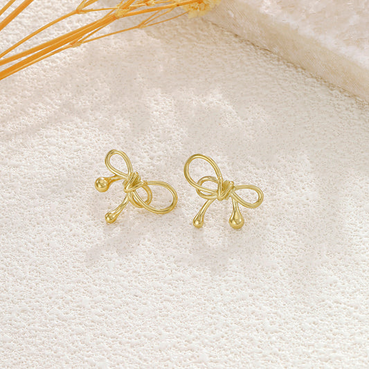 Boucles d'oreilles dorées nœud fin
