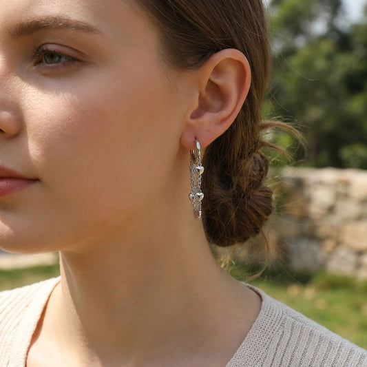 Boucles d'oreilles créoles argentées chaînes cœurs pendants