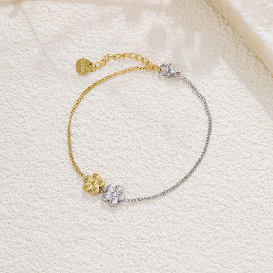 Bracelet bi-colore argenté et doré fleurs à 5 pétales reliée