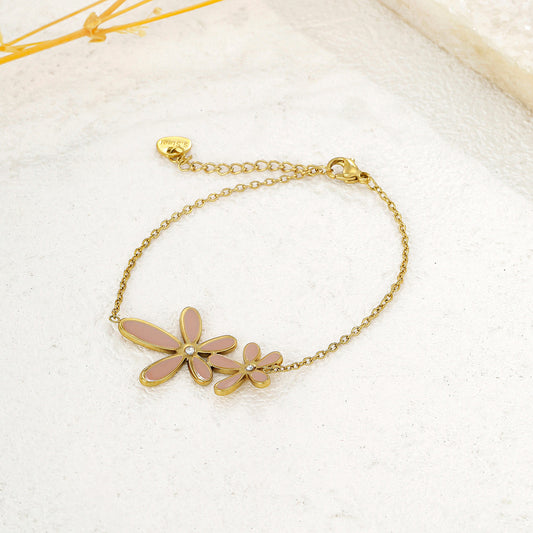 Bracelet chaîne dorée fine double fleur rose