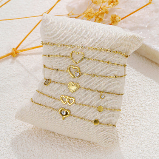 Lot de 6 bracelets dorés thème cœur sur coussin