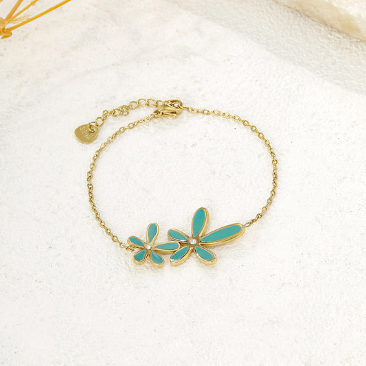 Bracelet chaîne dorée fine double fleur bleue