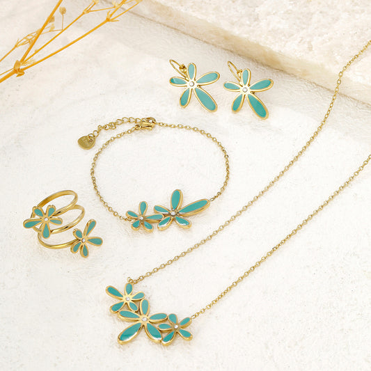 Bracelet chaîne dorée fine double fleur bleue