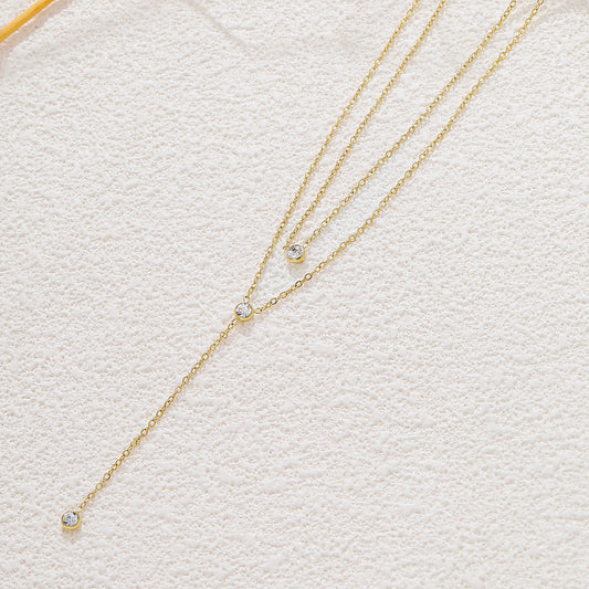 Collier doré double chaîne en Y strass ronds