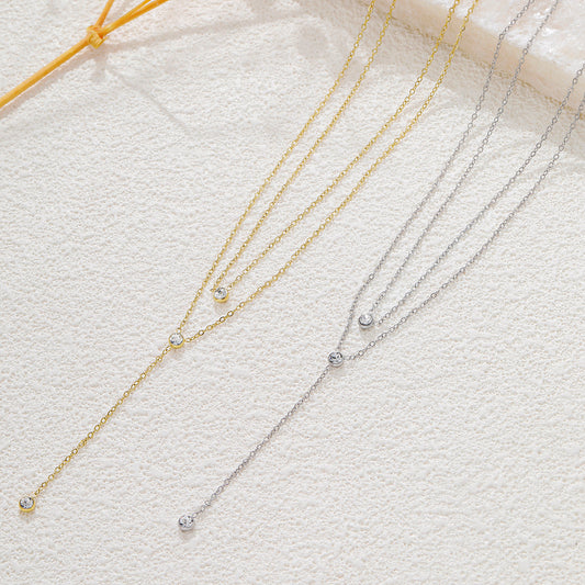 Collier doré double chaîne en Y strass ronds