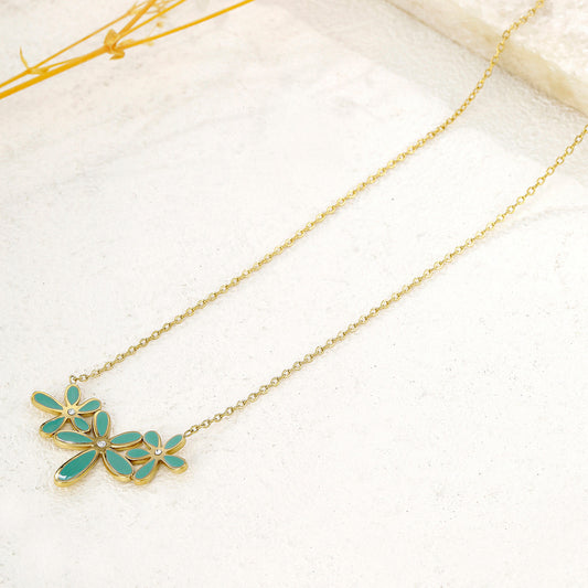 Collier chaîne dorée triple fleurs bleues