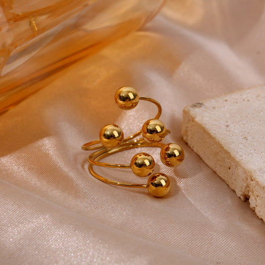 Bague dorée à boules ajustable devant