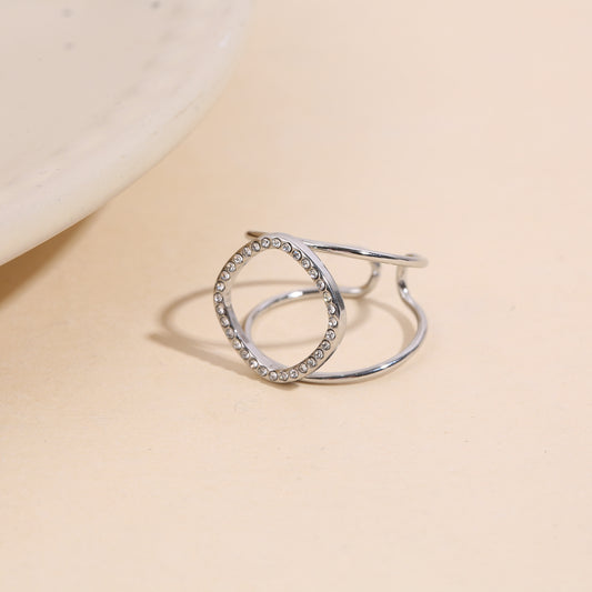 Bague argentée ajustable à double branche ajouré pavé de strass