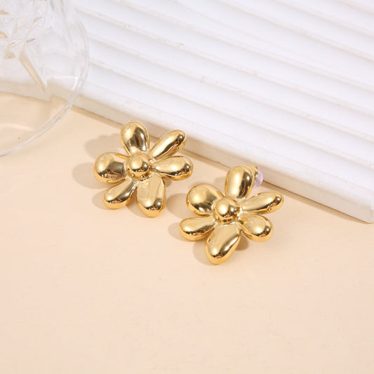 Boucles d'oreilles fleurs en volume dorées