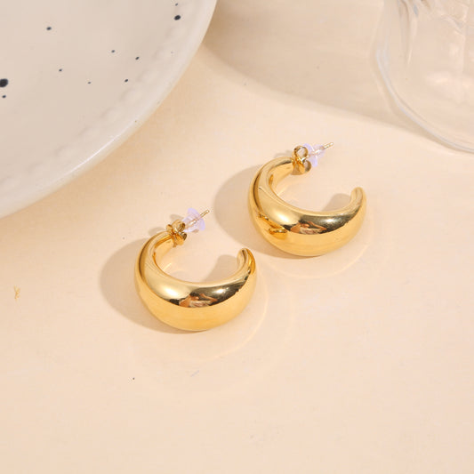 Boucles d'oreilles dorées créoles demi-lunes bombées large effet miroir