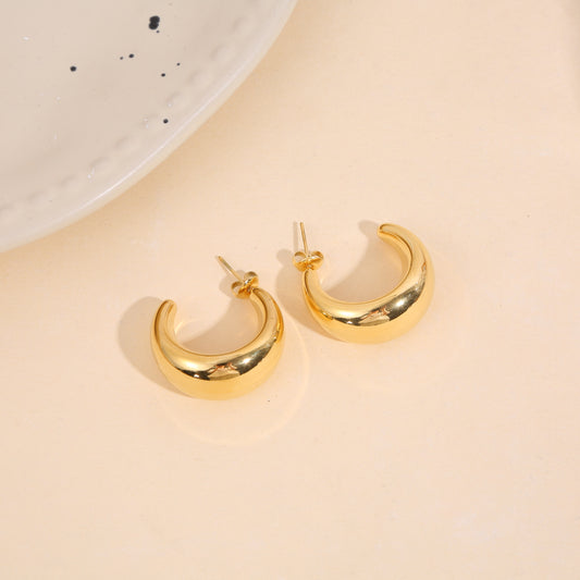 Boucles d'oreilles dorées créoles demi-lunes bombées large effet miroir