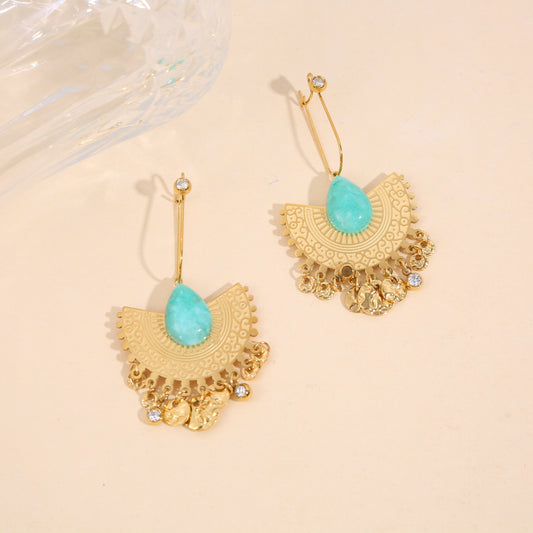 Boucles d'oreilles dorées pendantes gravure strass pierre bleue