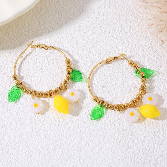 Boucles d'oreilles dorées créoles citrons et marguerites