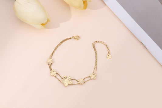 Bracelet Double Chaîne Dorée Avec Fleurs Délicates