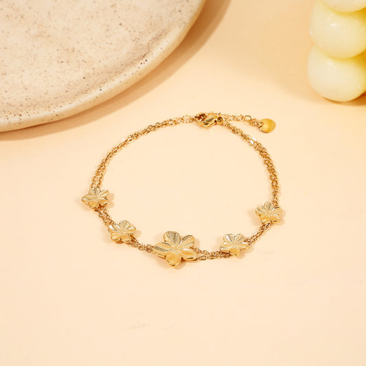 Bracelet Double Chaîne Dorée Avec Fleurs Délicates
