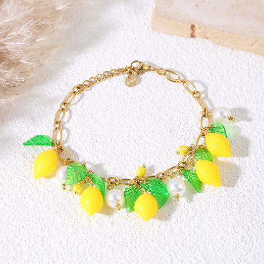 Bracelet chaîne dorée avec citrons et feuilles
