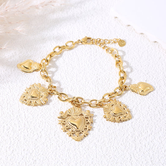 Bracelet doré avec 5 pendentifs ex-voto