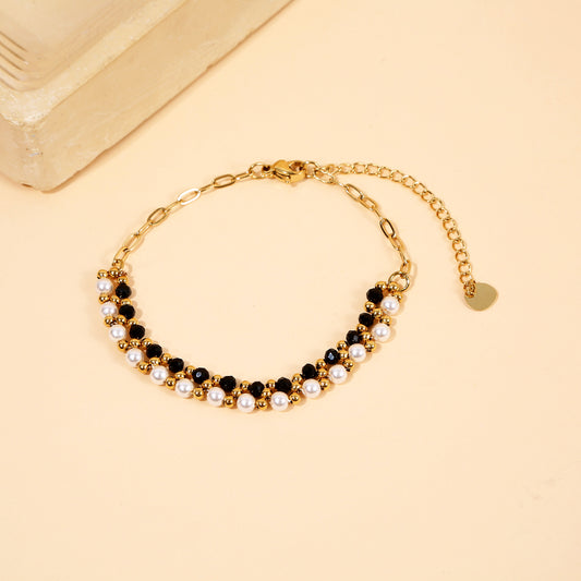 Bracelet Chaîne Dorée Avec Perles Blanches et Cristaux Noirs