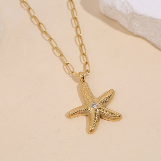 Collier chaîne dorée maillons étoile de mer avec strass