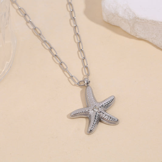 Collier chaîne argentée maillons étoile de mer avec strass