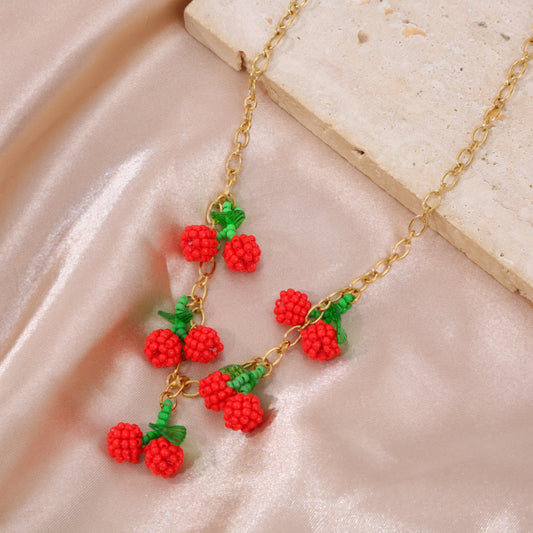 Collier doré 5 cerises tissés