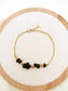 Bracelet chaîne dorée avec pierres noires