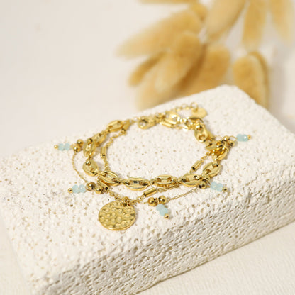 Triple chain bracelet with coffee bean, hammered pendant and blue crystals