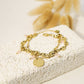 Triple chain bracelet with coffee bean, hammered pendant and blue crystals