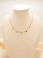 Collier doré avec petits pendentifs ronds