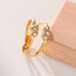 Bague dorée double ligne avec pétales à strass