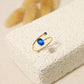 Bague dorée avec ouverture et strass bleu roi
