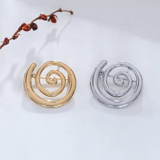 Broche argentée spirale